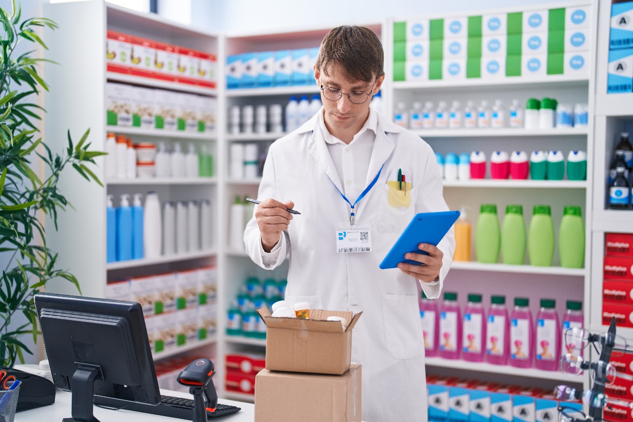 A Pharmacist tracking the medicine inventory with the help of barioo's ERP POS System